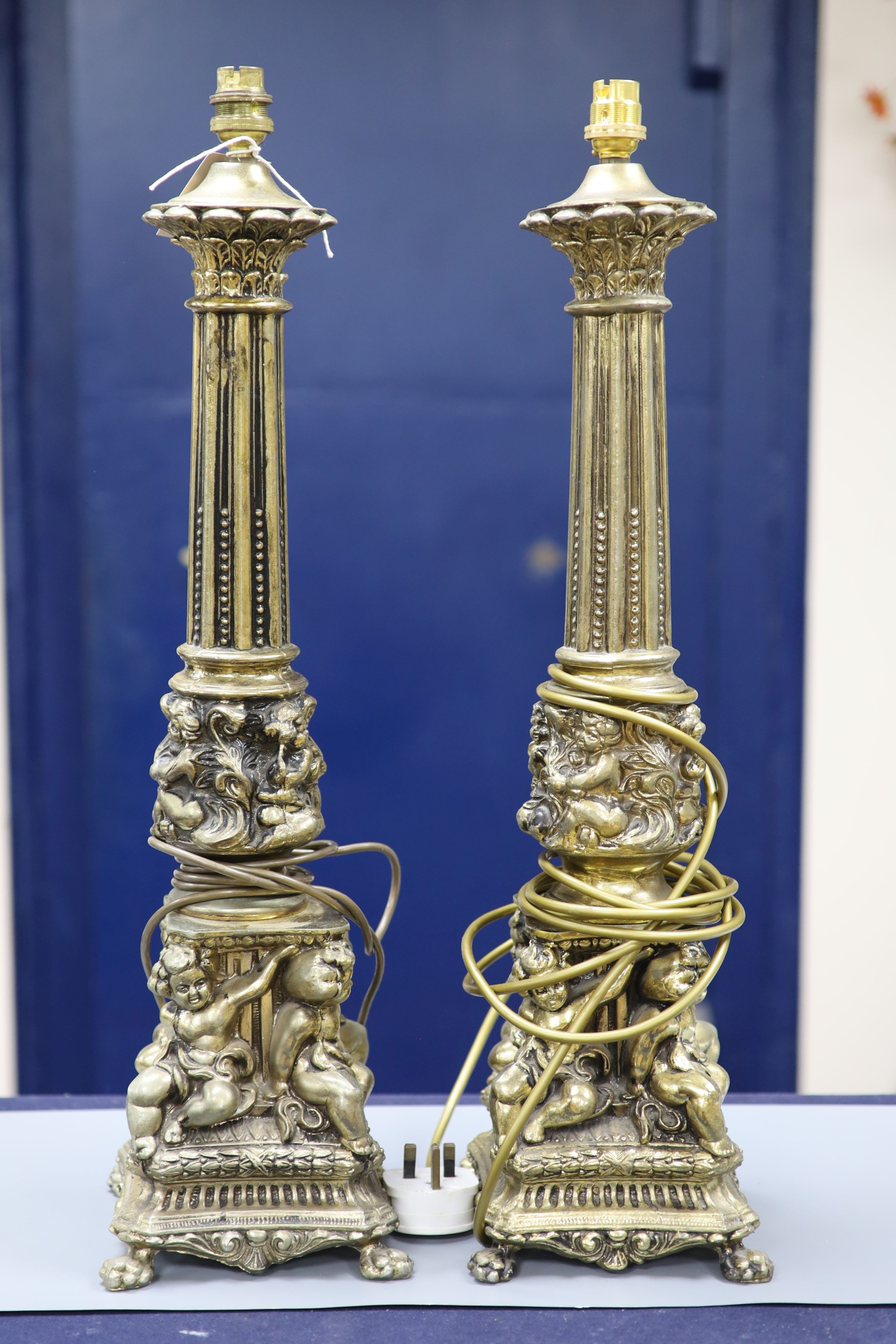 A pair of gilt metal column lamp bases, total height 61 cm